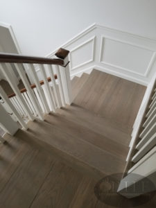 Custom made stain using a mix of country white and ebony stain and four coats water base satin.