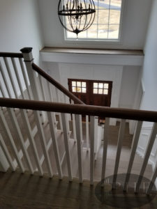 Custom made stain using a mix of country white and ebony stain and four coats water base satin.