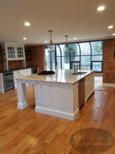 Old red oak refinished with one coat cherry stain and three coats oil based finish satin.