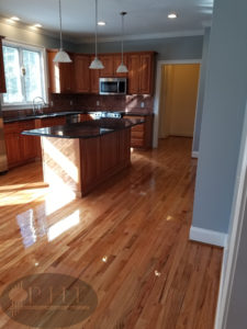 Red oak kitchen refinishing using three coats oil base finish.