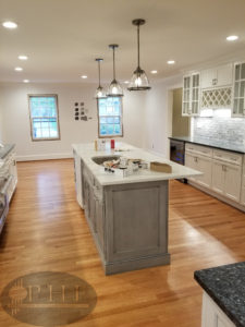 Refinished oak floors with one coat golden pecan stain and three coats oil base satin.