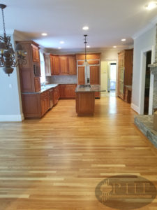 Dustless refinishing of white oak floors with three coats oil base finish satin.